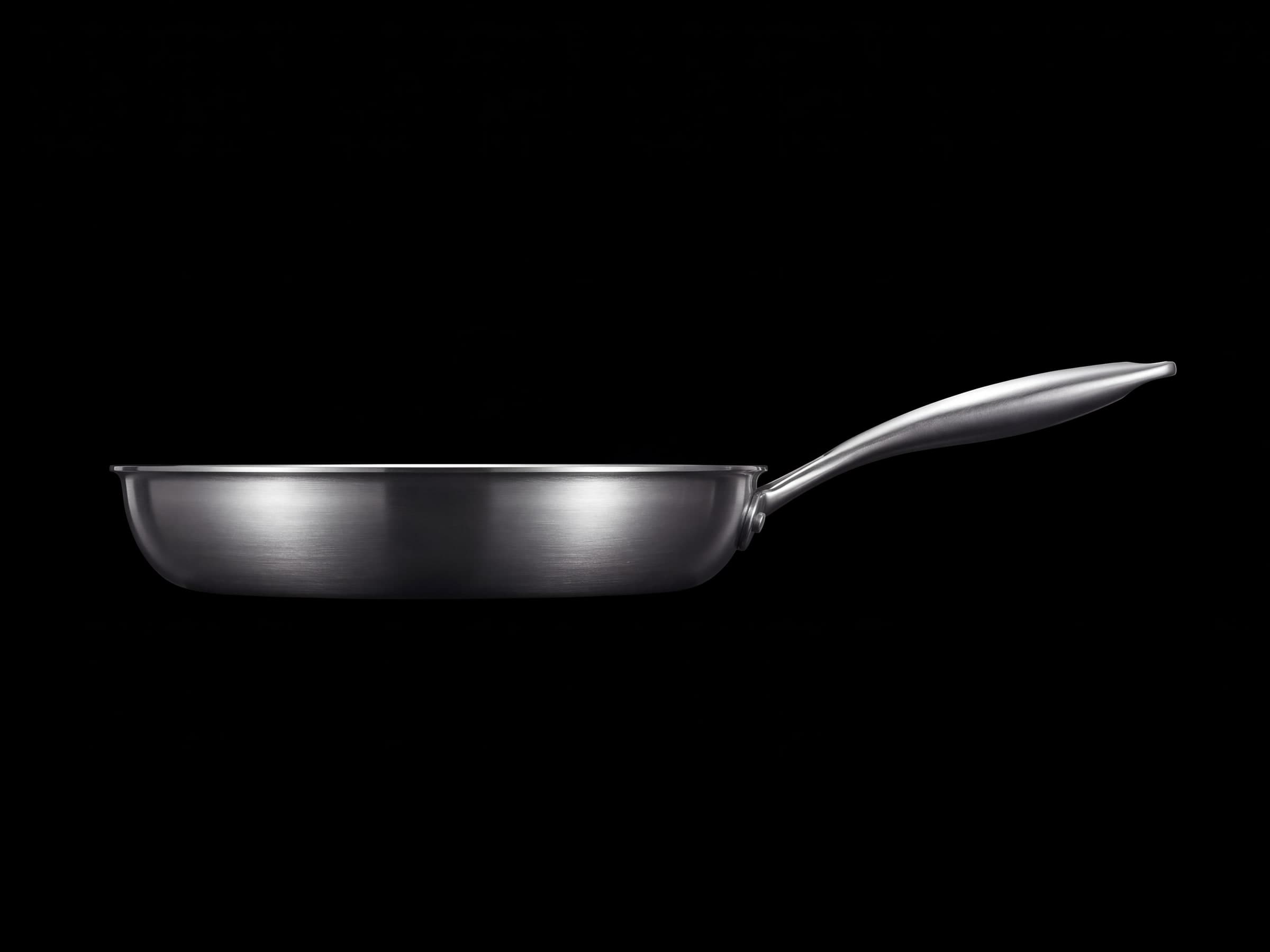 Side profile of the pan showing its flared walls and handle angle
