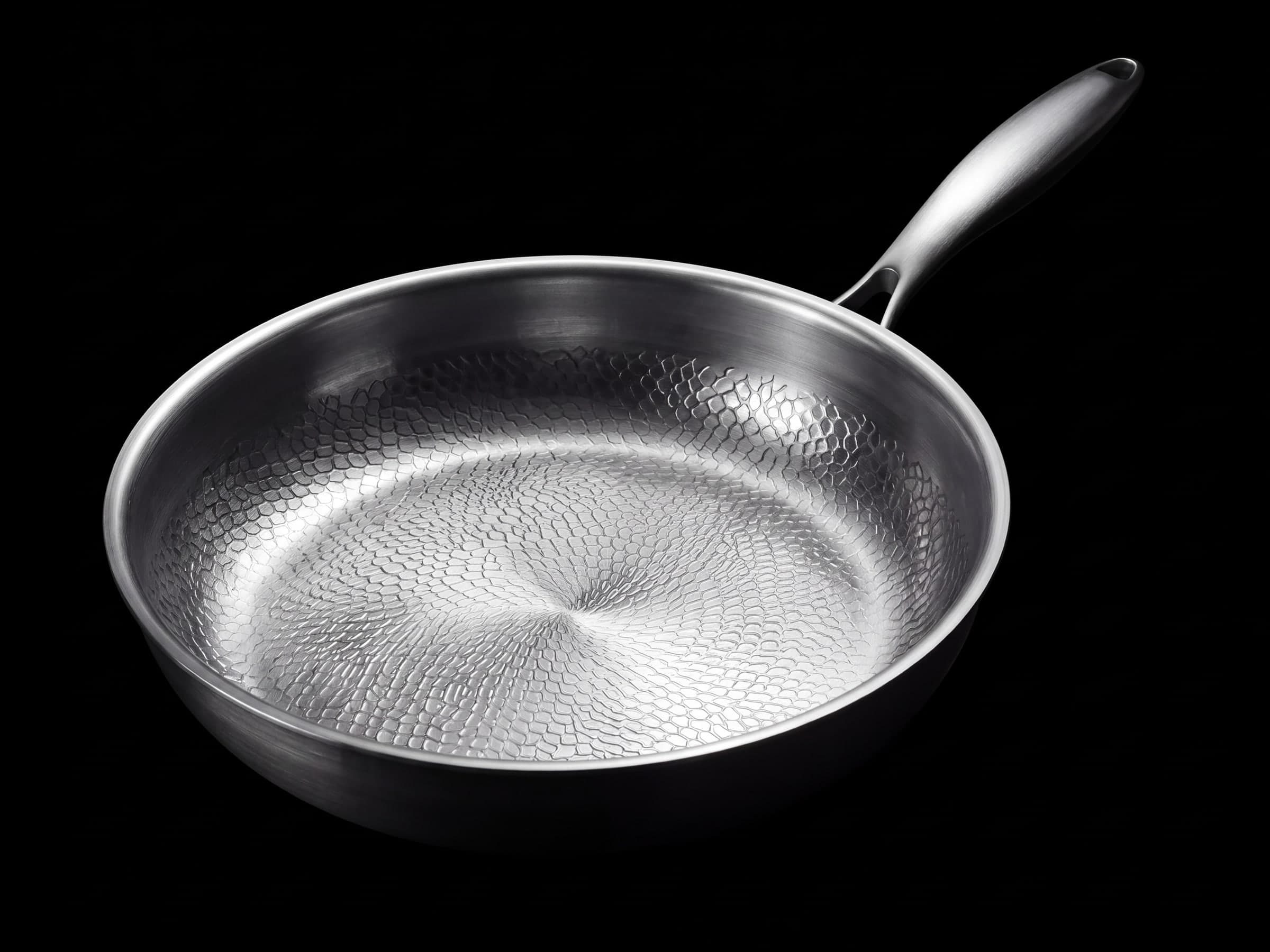 The titanium pan seen whole from a three-quarter angle