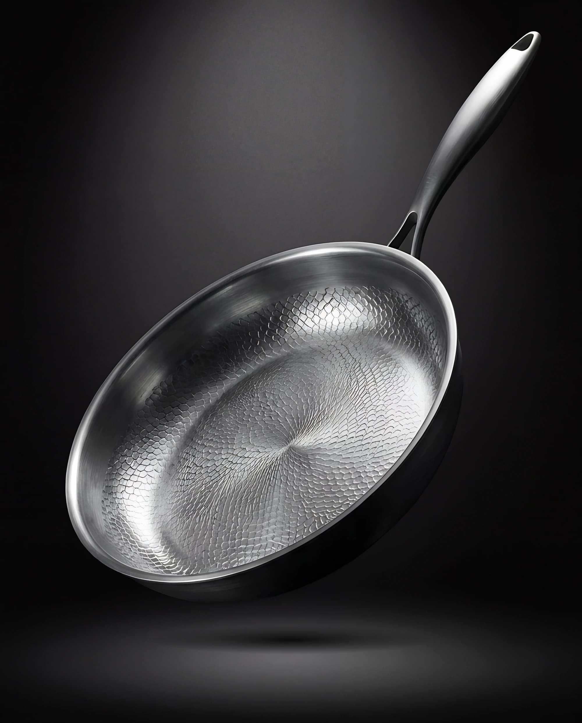 Titanium pan 32 cm floating against a dark backdrop